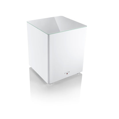 Canton Smart Sub 12 Wireless-Subwoofer Weiss Schrägansicht von oben mit Glasplatte auf dem Gehäuse